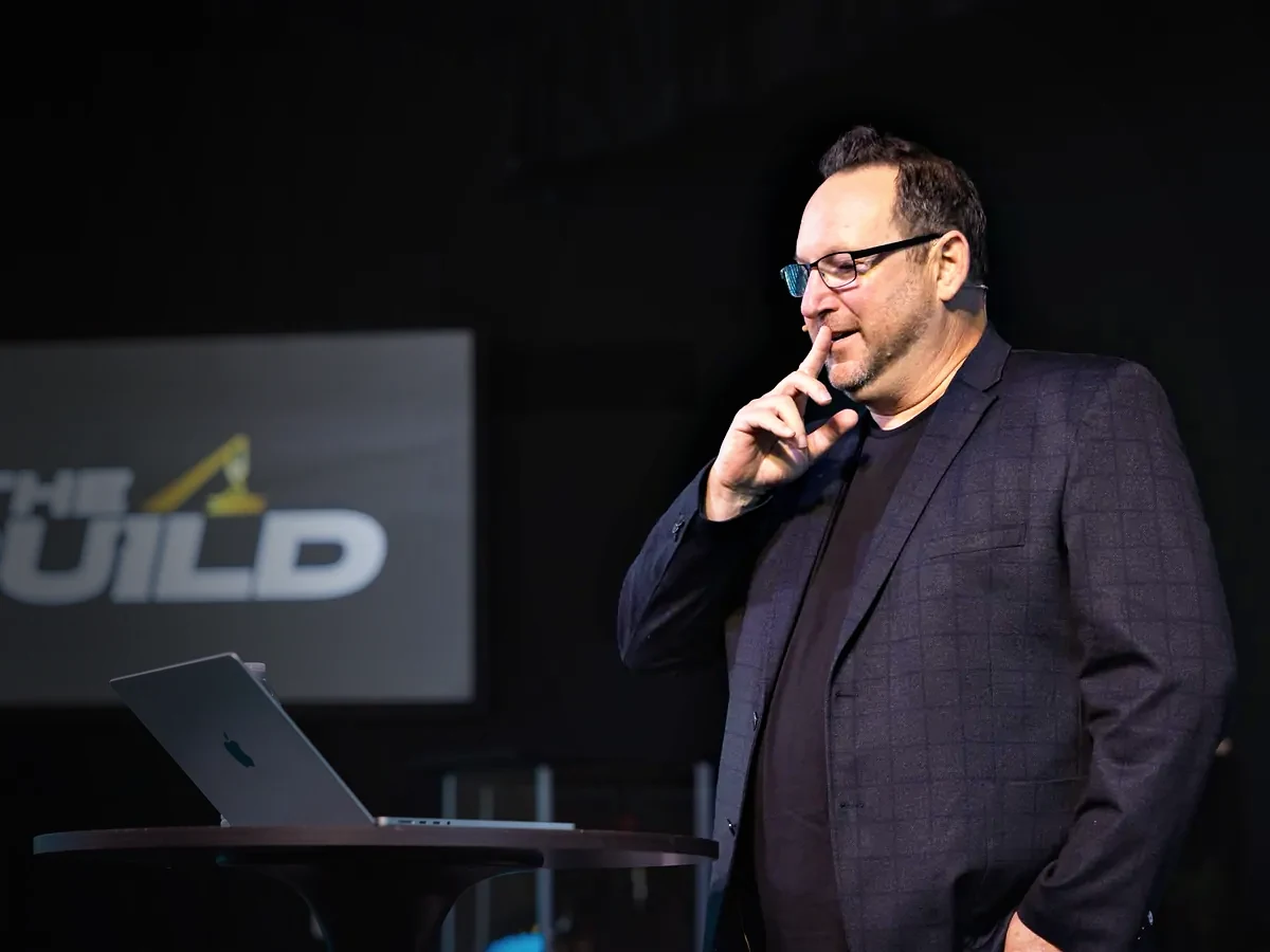 A speaker on stage at a live event